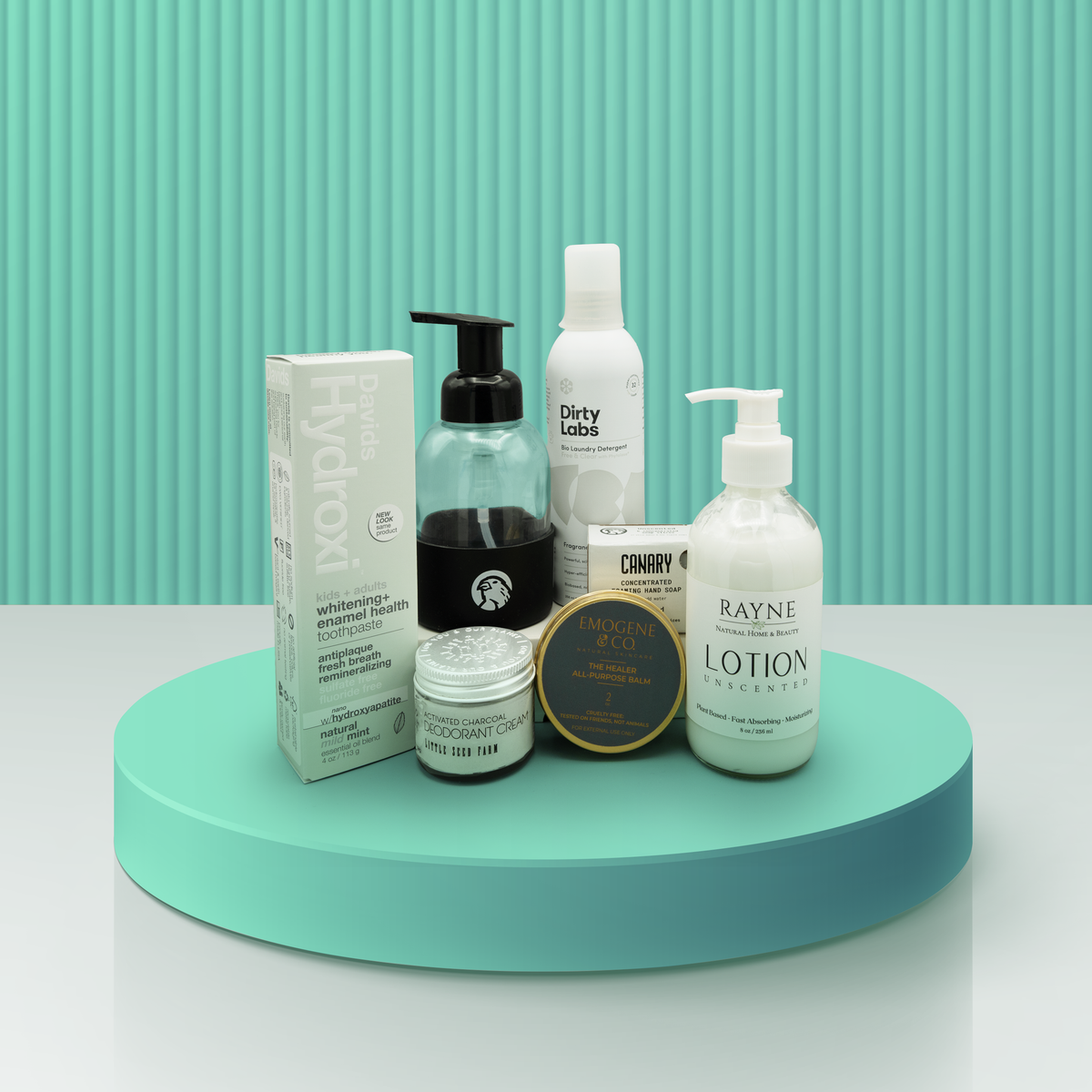 Our Cancer Support Kit containing Sensitive Toothpaste, Deodorant Cream, Refillable Hand Wash, Sensitive Laundry Care,  Emogene Healer Balm, and Rayne  natural Lotion Unscented.